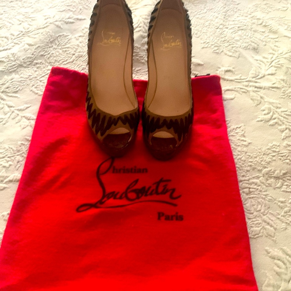 Worn Louboutin high heels. Tips on heels need to be replaced.